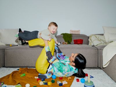 mother playing with baby